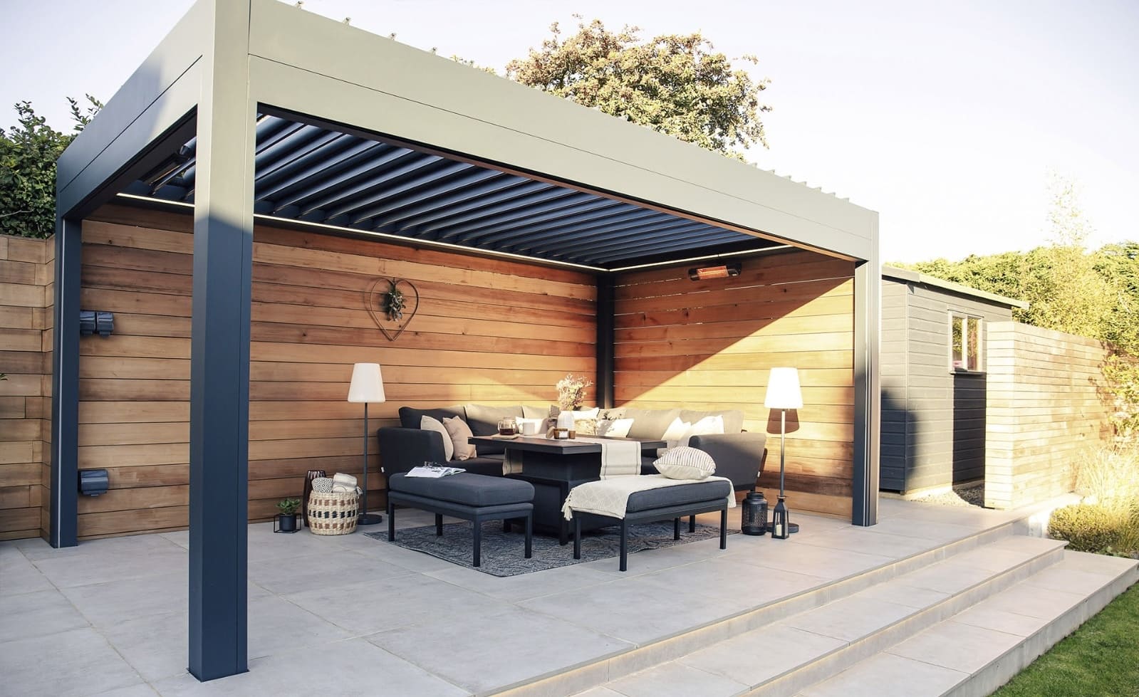 Pergola interior with LED strip lighting, heater and side screen